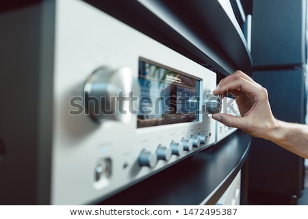 Сток-фото: Hand Of Woman Turning Up Volume Of Hi Fi Amplifier