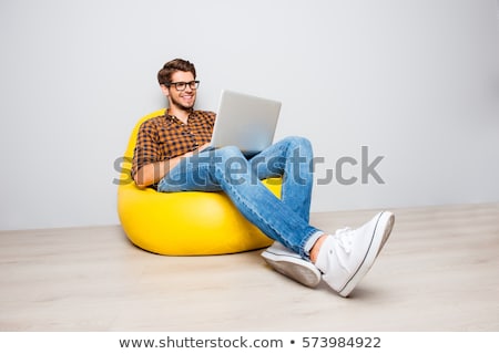 Сток-фото: Young Man Using Laptop On Floor Smiling