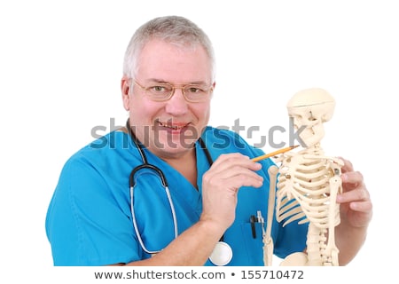 Foto stock: Funny Doctor With Skeleton In Hospital