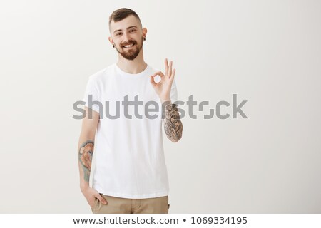 Foto stock: Handsome Stylish Young Man With Tattoo And Piercing