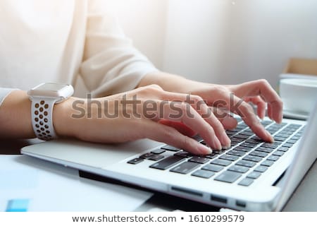 Foto stock: Hands Typing On Computer Keyboard