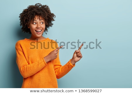 Stockfoto: Woman Pointing At Blank Space