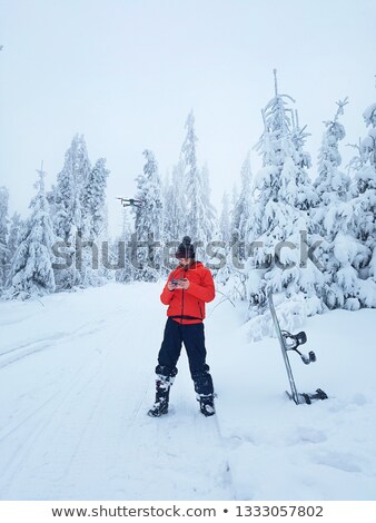 Stock fotó: Snowboarder Controls The Drone During A Break In Skating