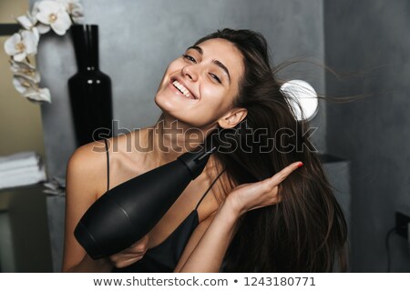 ストックフォト: Photo Of Happy Woman With Long Dark Hair Standing In Bathroom A