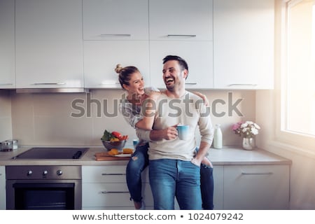 Foto d'archivio: Young Couple In A Kitchen