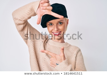 Foto d'archivio: Smiling Young Woman Making Frame Shape With Hand