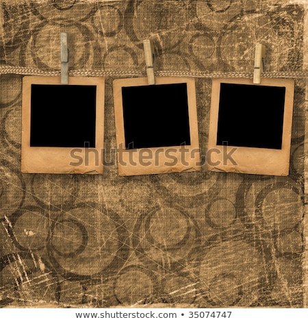 Foto stock: Old Photoframes Are Hanging In The Row