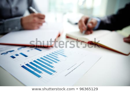 Graphique d'entreprise avec des stylos [[stock_photo]] © Pressmaster