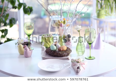 Foto d'archivio: Easter Table Setting With Flowers And Eggs Decorative Plates With Boiled Eggs