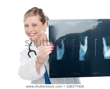 Stock photo: Female Surgeon Showing X Ray Reports To Camera