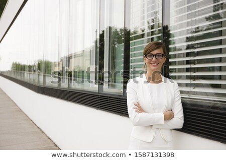 Stok fotoğraf: Woman Standing In Front Of The Building