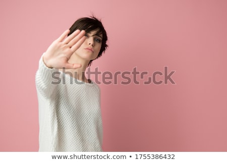 Stock photo: Young Woman Making Stop Gesture Sign