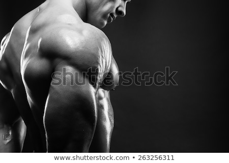 Fitness Guy With Weight Showing Muscles Stok fotoğraf © restyler