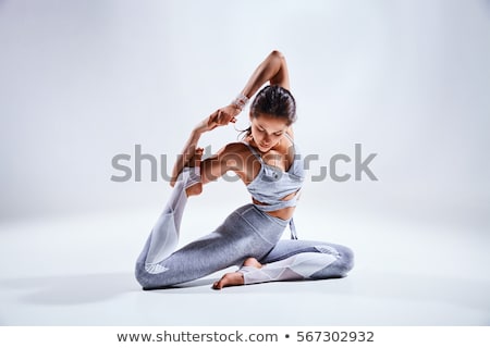 Foto d'archivio: Young Beautiful Woman Yoga Posing Isolated