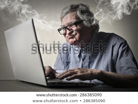 ストックフォト: Tired Elderly Businessman Writing In Notebook