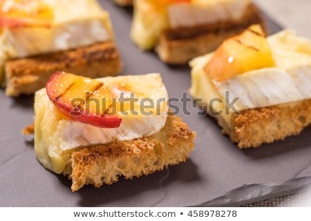 Foto stock: Canapes With Grilled Brie And Nectarine