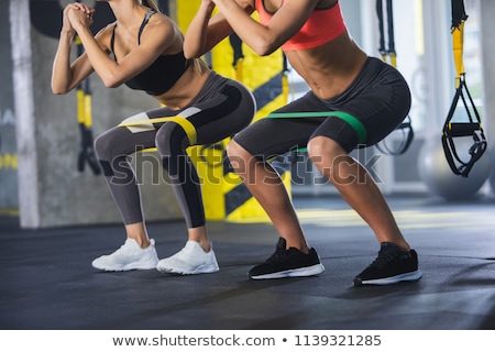 Stok fotoğraf: Sitting Woman Wearing Latex Clothes