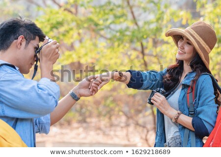 Stok fotoğraf: Girlfriend Taking Picture Of Her Boyfriend