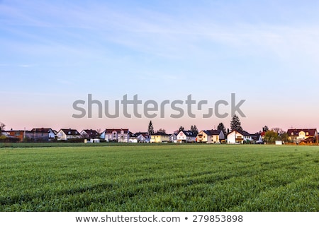 Stok fotoğraf: Rural Landscape In Munich With New Settlement And Fields