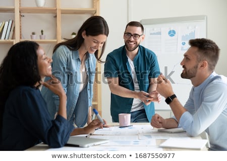 [[stock_photo]]: Team Of Business Person Works Together On Company Statistics Concept Of Teamwork