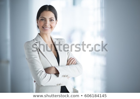 Stock fotó: Young Businesswoman Standing Arms Crossed Smiling