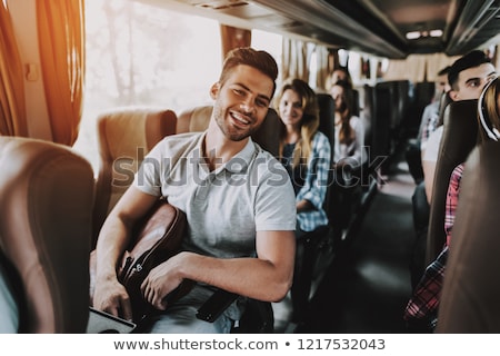 ストックフォト: Group Of Happy Passengers Travelling By Bus