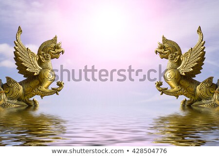 Foto stock: Golden Eagle Statue On A White Background