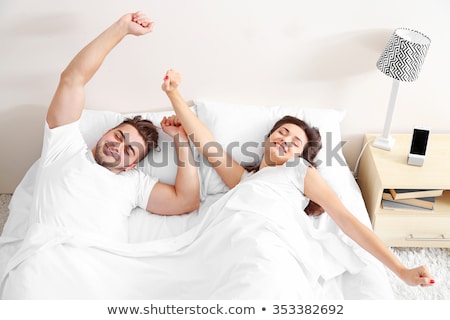 ストックフォト: Couple Waking Up In The Morning