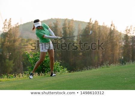 Stok fotoğraf: Woman Is Playing Golf On Course Summer