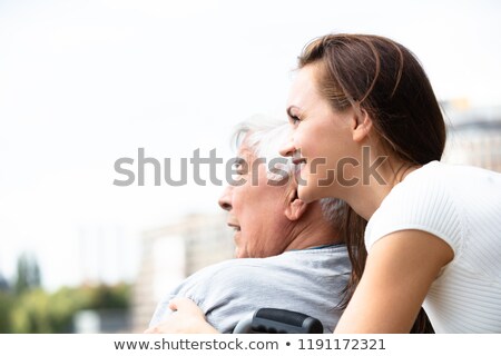 Stock foto: Woman With Her Disabled Father Near Railing