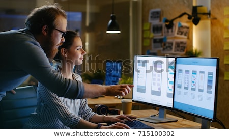 Stok fotoğraf: Creative Team Drinking Coffee At Night Office