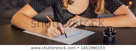 [[stock_photo]]: Good Morning Calligrapher Young Woman Writes Phrase On White Paper Inscribing Ornamental Decorated