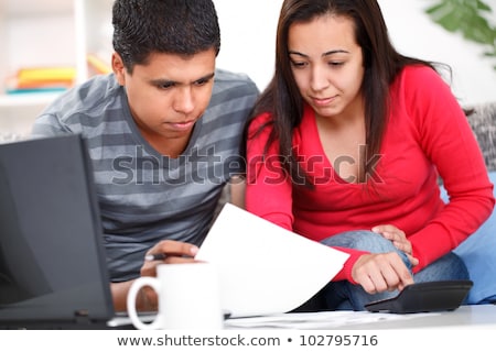 Сток-фото: Unhappy Man Doing Computer On A Couch