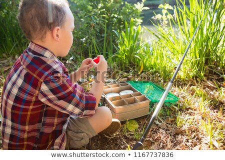 Stockfoto: Boy Preparing A Bait In The Forest