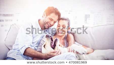 Stockfoto: Happy Couple With Their Dog