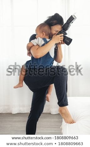 [[stock_photo]]: Cute Female Photographer With Her Dslr Camera Taking Photos