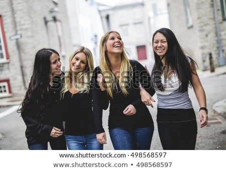 Foto stock: Four Young Good Girl Friend People In The City