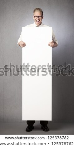 Stock photo: Overjoyed Businessman Holding Empty Vertical Panel