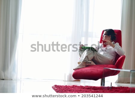 Calm Woman Touching Her Tablet Pc [[stock_photo]] © dotshock