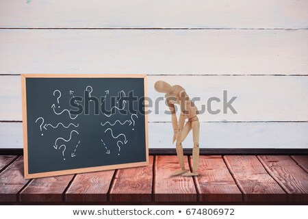 Stock photo: Injured Wooden Figurine Standing With Hands On Knee