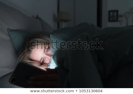 Zdjęcia stock: Sad Woman In Blanket Using Smartphone At Home