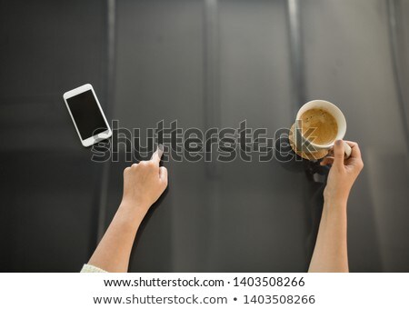 Stockfoto: Woman With Coffee Using Black Interactive Panel