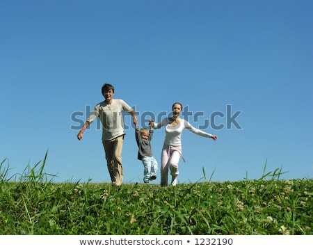 Stock photo: Family On Herb Under Blue Sky