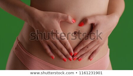 Сток-фото: Composite Image Of Closeup Mid Section Of A Fit Woman With Stoma