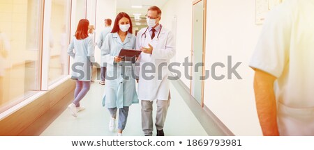 [[stock_photo]]: Discussing Treatment Methods With Colleague