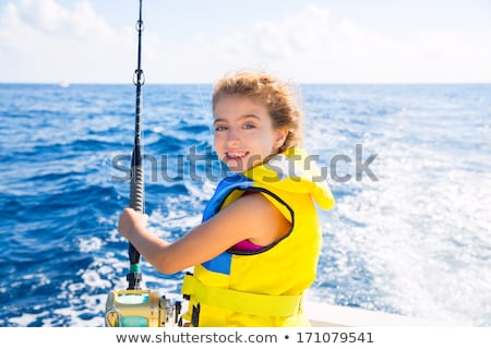 Stok fotoğraf: Girl In Yellow Jacket Laughing