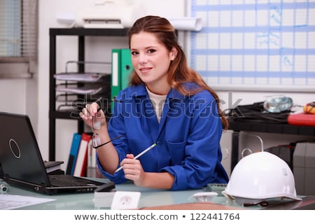 Stock photo: Manual Worker In Office Ordering Parts