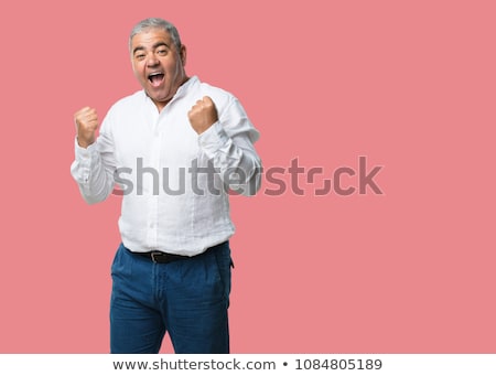 Stockfoto: Portrait Of An Enthusiastic Man Celebrating A Success