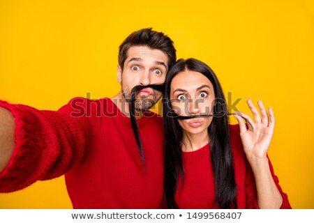 Stock foto: Close Up Girl With Red Hair And Guy Grimace