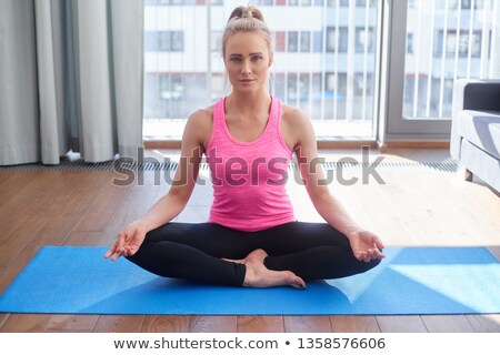 Stockfoto: Attractive Young Female With Legs Crossed